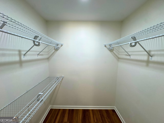 3340 Zingara Rd, Conyers, GA 30012 - spacious closet with wood finished floors