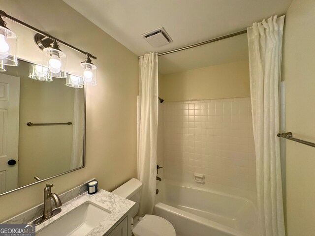 3340 Zingara Rd, Conyers, GA 30012 - bathroom featuring toilet, shower / bath combination with curtain, and vanity