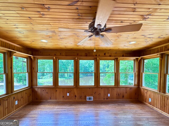 3340 Zingara Rd, Conyers, GA 30012 - unfurnished sunroom with wood ceiling, healthy amount of natural light, wooden walls, baseboards, and wood-type flooring