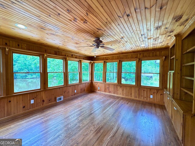 3340 Zingara Rd, Conyers, GA 30012 - unfurnished sunroom featuring wooden ceiling, wood finished floors, wooden walls, and baseboards
