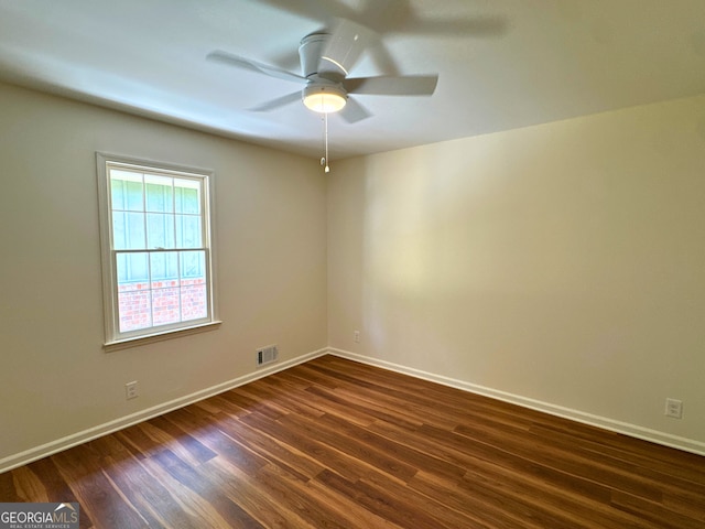 3340 Zingara Rd, Conyers, GA 30012 - spare room featuring dark wood-style floors, baseboards, and ceiling fan