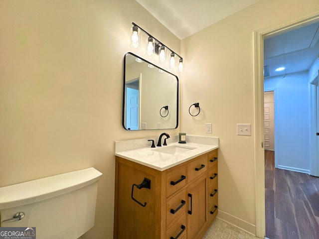 3340 Zingara Rd, Conyers, GA 30012 - bathroom with baseboards, vanity, and toilet