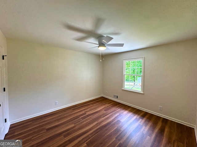 3340 Zingara Rd, Conyers, GA 30012 - unfurnished room with dark wood-style flooring, ceiling fan, and baseboards
