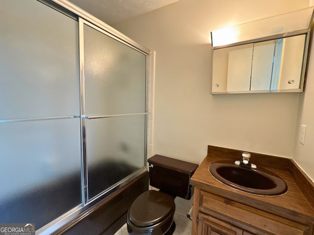 3340 Zingara Rd, Conyers, GA 30012 - full bath featuring combined bath / shower with glass door, toilet, and vanity