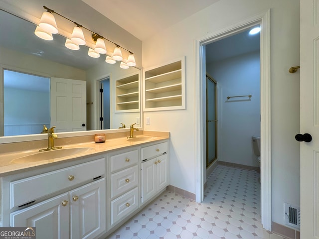 3340 Zingara Rd, Conyers, GA 30012 - full bath with tile patterned floors, double vanity, a stall shower, baseboards, and toilet
