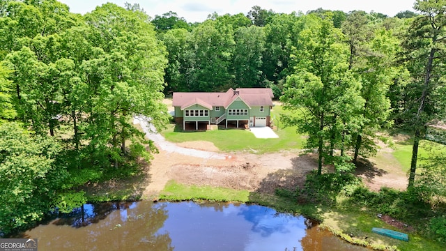 3340 Zingara Rd, Conyers, GA 30012 - aerial view of property and surrounding area with a large body of water and a forest