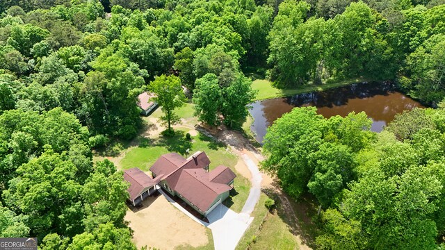 3340 Zingara Rd, Conyers, GA 30012 - aerial overview of property's location with a large body of water and a forest