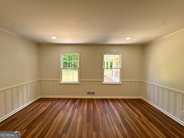 3340 Zingara Rd, Conyers, GA 30012 - empty room featuring dark wood finished floors, wainscoting, crown molding, and recessed lighting