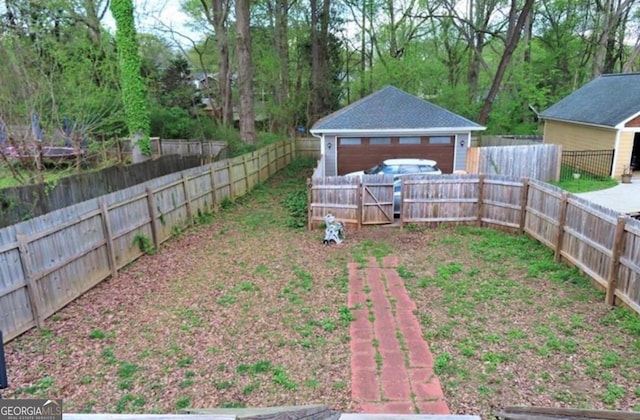 2132 Memorial Dr SE, Atlanta, GA 30317 - fenced backyard with a garage