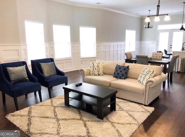 2132 Memorial Dr SE, Atlanta, GA 30317 - living area featuring french doors, a decorative wall, wainscoting, crown molding, and dark wood finished floors