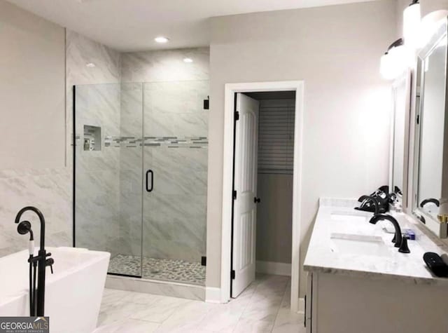 2132 Memorial Dr SE, Atlanta, GA 30317 - bathroom with a freestanding bath, a stall shower, marble look tile flooring, double vanity, and recessed lighting