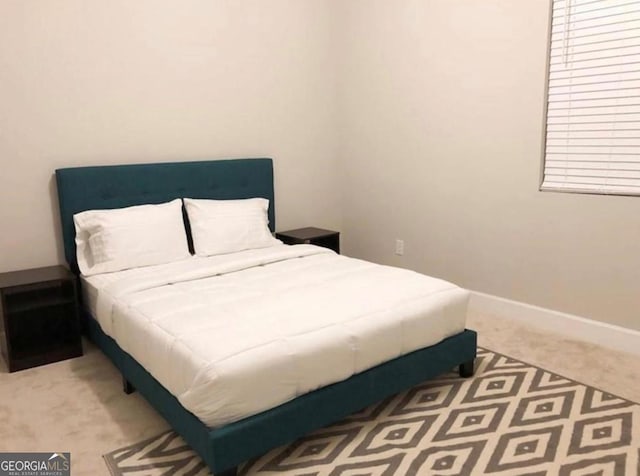 2132 Memorial Dr SE, Atlanta, GA 30317 - carpeted bedroom featuring baseboards