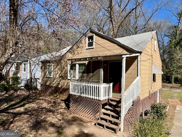 view of front of house featuring a porch and a shingled roof