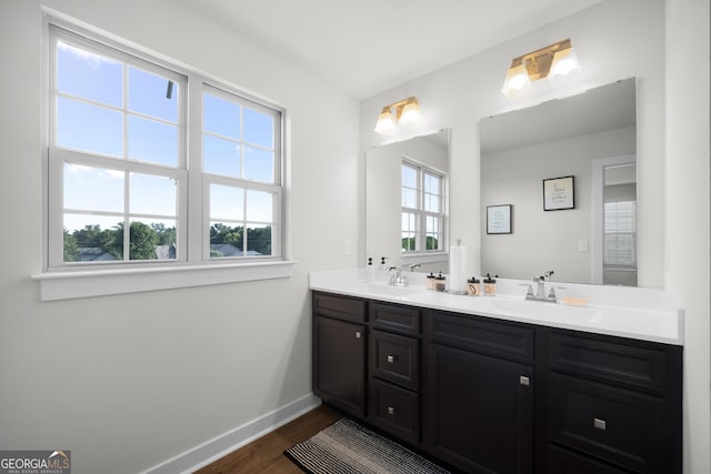 838 Maduro Way, Mcdonough, GA 30253 - full bath with wood finished floors, baseboards, and double vanity