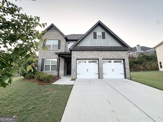view of front of home with a front lawn, a garage, driveway, and brick siding