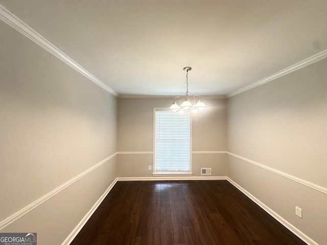 4313 Executive Dr, Stone Mountain, GA 30083 - unfurnished dining area with a chandelier, dark wood-style floors, baseboards, and ornamental molding