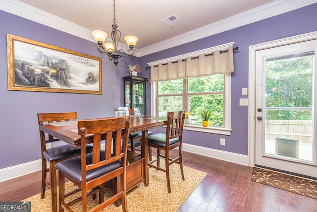 139 Village Park Dr, Newnan, GA 30265 - dining room with a chandelier, baseboards, ornamental molding, and hardwood / wood-style floors
