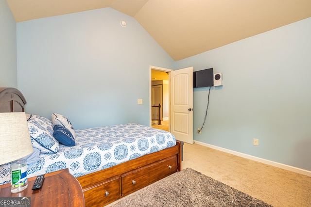 139 Village Park Dr, Newnan, GA 30265 - bedroom featuring vaulted ceiling, light carpet, and baseboards