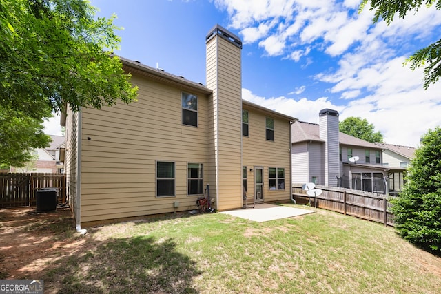 139 Village Park Dr, Newnan, GA 30265 - rear view of property featuring a patio, a chimney, and central AC unit