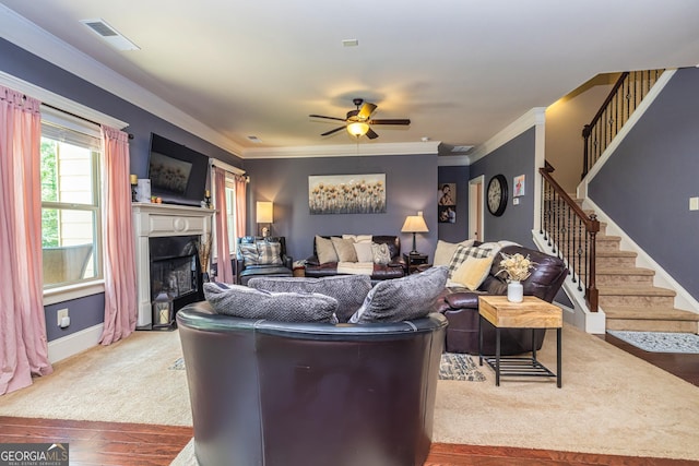139 Village Park Dr, Newnan, GA 30265 - living room with a ceiling fan, stairway, a fireplace, hardwood / wood-style flooring, and crown molding