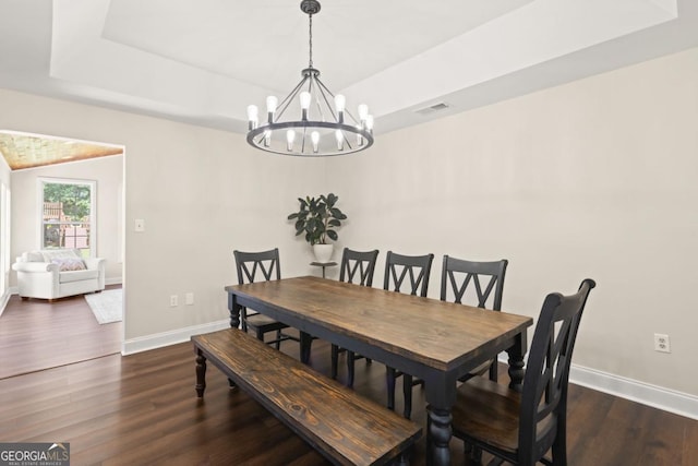 109 Principal Way, Guyton, GA 31312 - dining room featuring baseboards, wood finished floors, a chandelier, and a tray ceiling