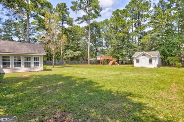 109 Principal Way, Guyton, GA 31312 - view of yard featuring a playground, an outdoor structure, and view of scattered trees