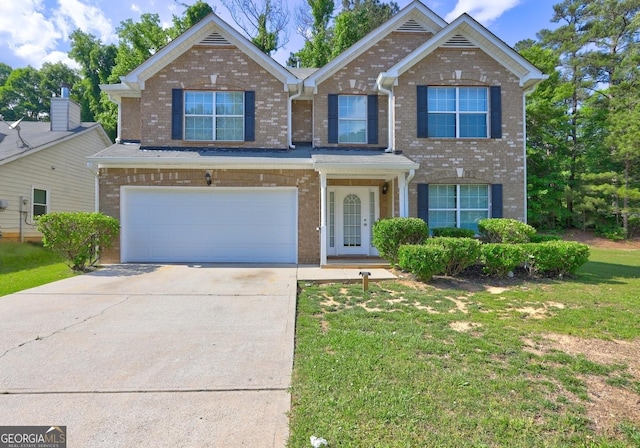 traditional home with brick siding, driveway, an attached garage, and a front lawn