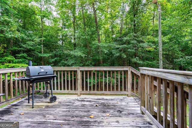 wooden deck with area for grilling