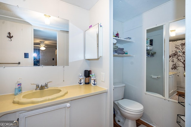 bathroom with ceiling fan, vanity, and toilet
