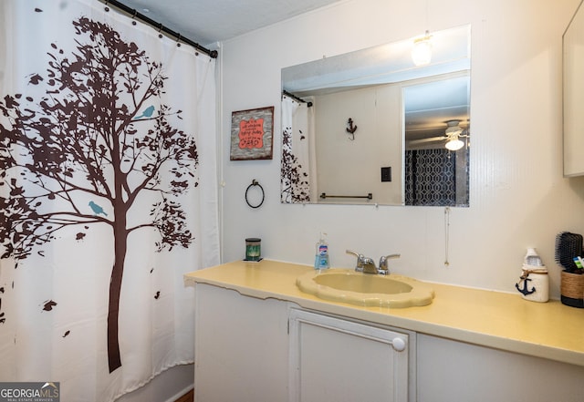 bathroom with vanity and a ceiling fan
