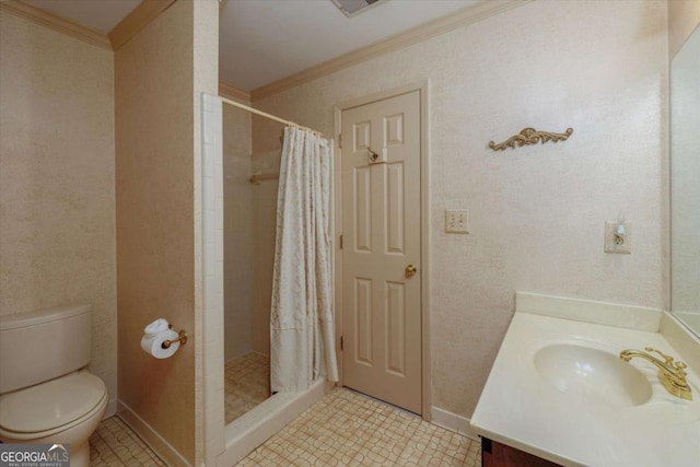 bathroom with crown molding, a shower stall, toilet, vanity, and baseboards