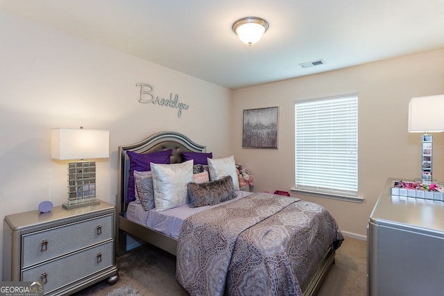 carpeted bedroom with baseboards