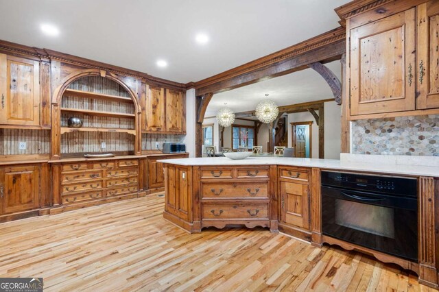 355 Clark Creek Pass, Acworth, GA 30102 - kitchen featuring light countertops, tasteful backsplash, a peninsula, recessed lighting, and ornamental molding