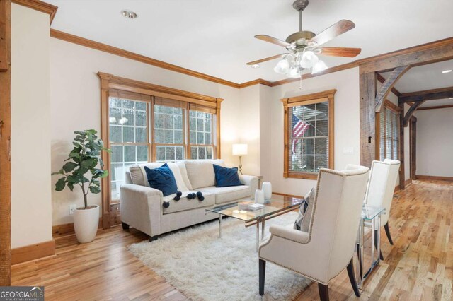 355 Clark Creek Pass, Acworth, GA 30102 - living room with light wood-style floors, a ceiling fan, a fireplace, ornamental molding, and recessed lighting