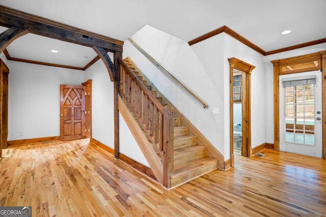 355 Clark Creek Pass, Acworth, GA 30102 - living area featuring light wood-style flooring, baseboards, crown molding, and a ceiling fan