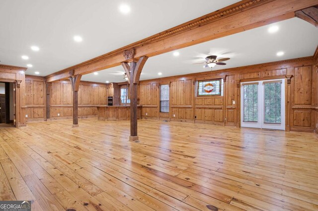 355 Clark Creek Pass, Acworth, GA 30102 - unfurnished living room with ceiling fan, wooden walls, light wood finished floors, crown molding, and recessed lighting