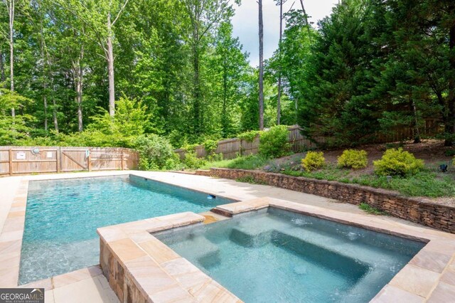 355 Clark Creek Pass, Acworth, GA 30102 - view of pool featuring a fenced backyard and an in-ground hot tub