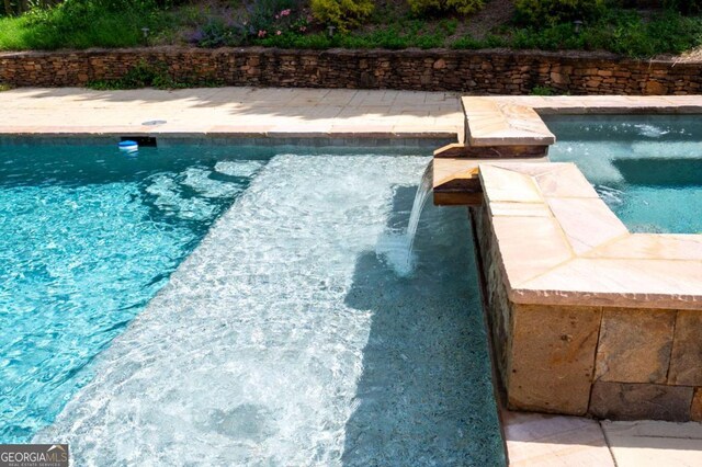 355 Clark Creek Pass, Acworth, GA 30102 - view of pool featuring a fenced backyard and a pool with connected hot tub