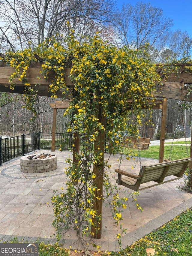 355 Clark Creek Pass, Acworth, GA 30102 - view of patio / terrace with a fire pit, fence, and a pergola