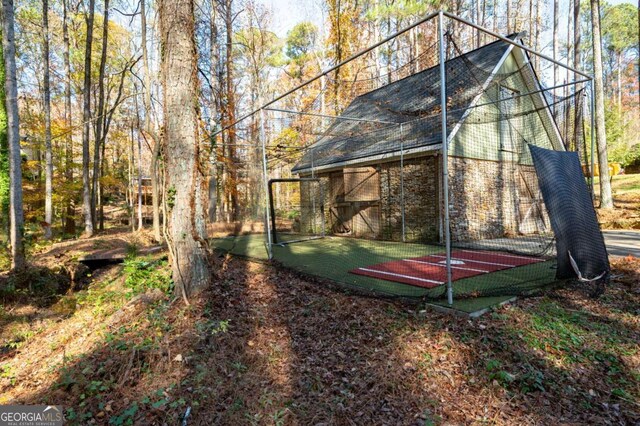 355 Clark Creek Pass, Acworth, GA 30102 - view of barn featuring a wooded view