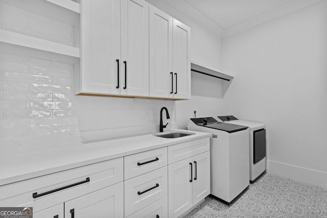 400 Auburn Rd, Auburn, GA 30011 - clothes washing area with washing machine and clothes dryer, cabinet space, and baseboards