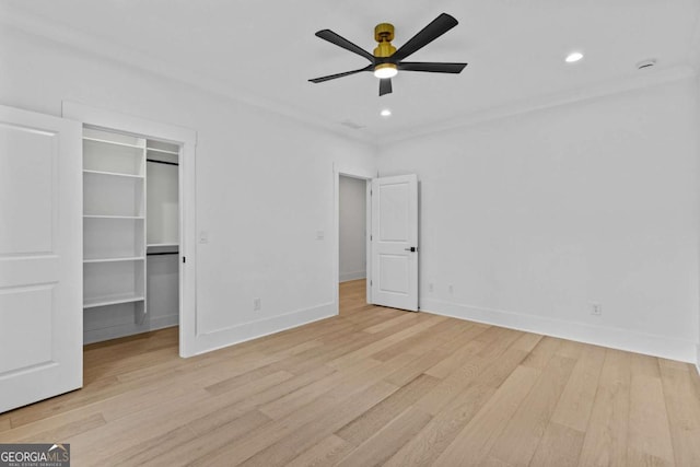 400 Auburn Rd, Auburn, GA 30011 - unfurnished bedroom with wood finished floors, a walk in closet, baseboards, recessed lighting, and ceiling fan