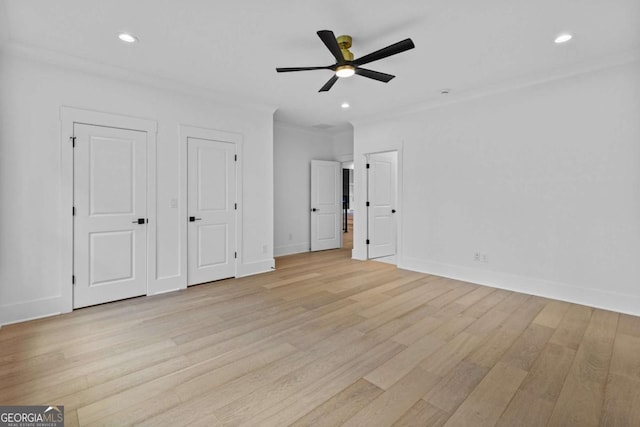 400 Auburn Rd, Auburn, GA 30011 - unfurnished bedroom with light wood-style flooring, baseboards, recessed lighting, crown molding, and multiple closets