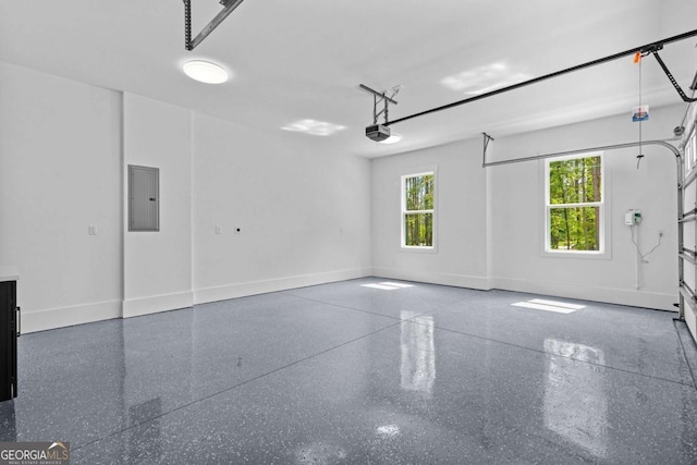 400 Auburn Rd, Auburn, GA 30011 - garage with electric panel, a garage door opener, and baseboards