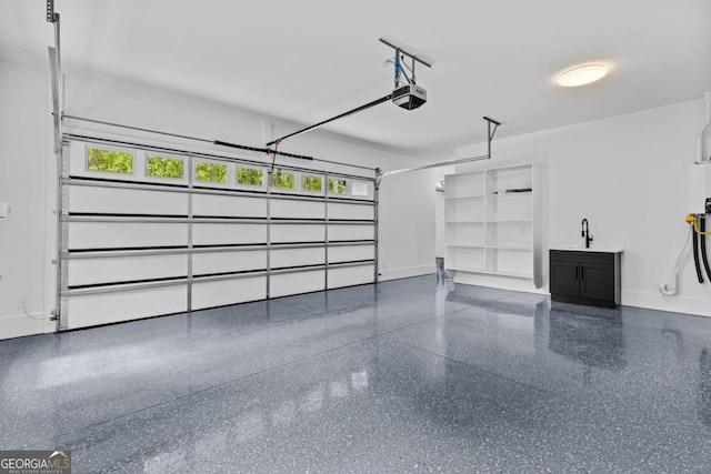 400 Auburn Rd, Auburn, GA 30011 - garage featuring a garage door opener, a sink, and baseboards