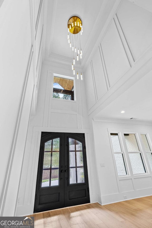 400 Auburn Rd, Auburn, GA 30011 - entryway with crown molding, french doors, a chandelier, wood finished floors, and a high ceiling
