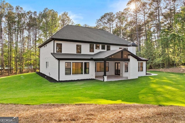 400 Auburn Rd, Auburn, GA 30011 - back of property with a patio area, a yard, and a shingled roof