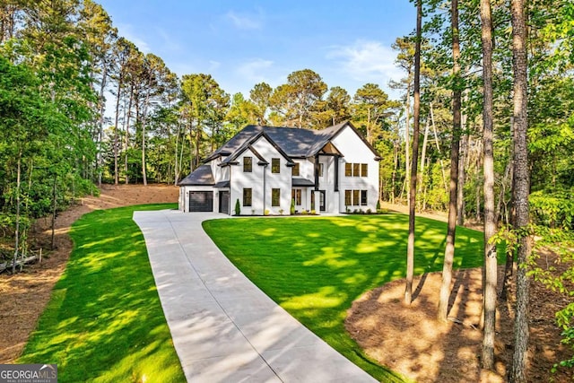 400 Auburn Rd, Auburn, GA 30011 - view of front of house with concrete driveway, a front lawn, and view of scattered trees