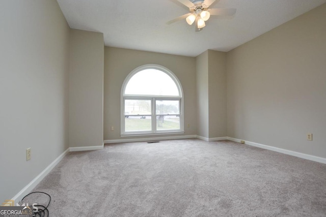 122 Wilson Cir, Carrollton, GA 30117 - empty room with carpet floors, ceiling fan, and baseboards