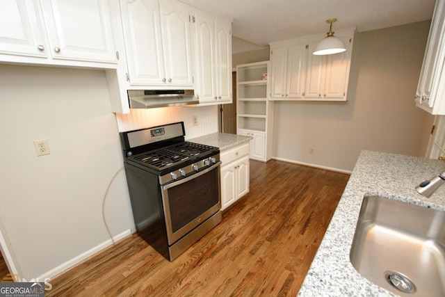 122 Wilson Cir, Carrollton, GA 30117 - kitchen with gas stove, ventilation hood, a sink, white cabinetry, and wood finished floors